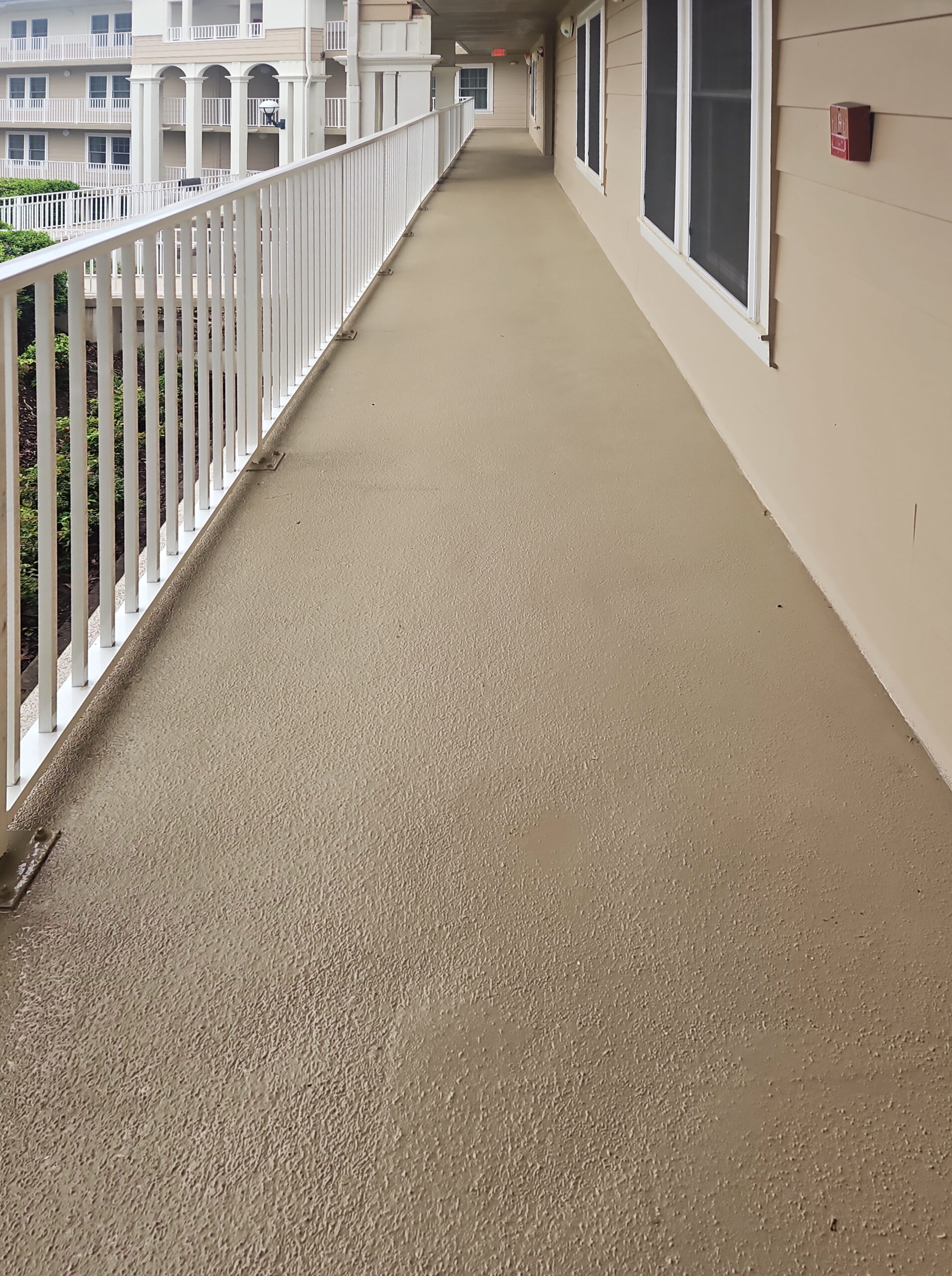 Newly coated exterior walkway at Hilton Sunrise Ridge
