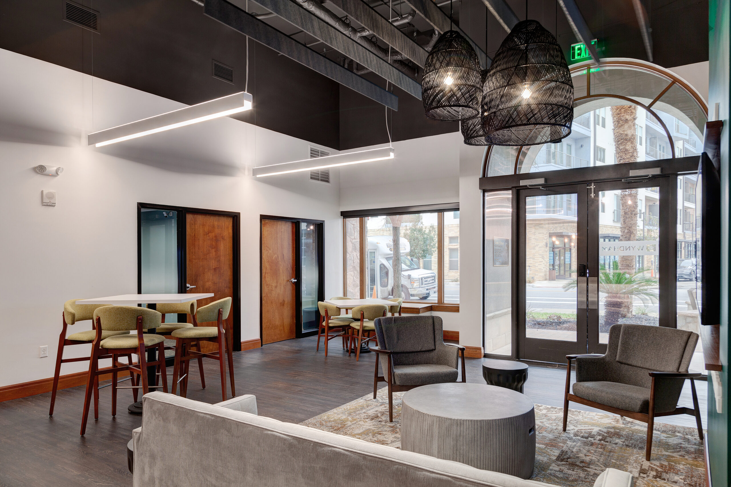 Cafe and lounge area at the La Cascada sales centre with arched entrance doors