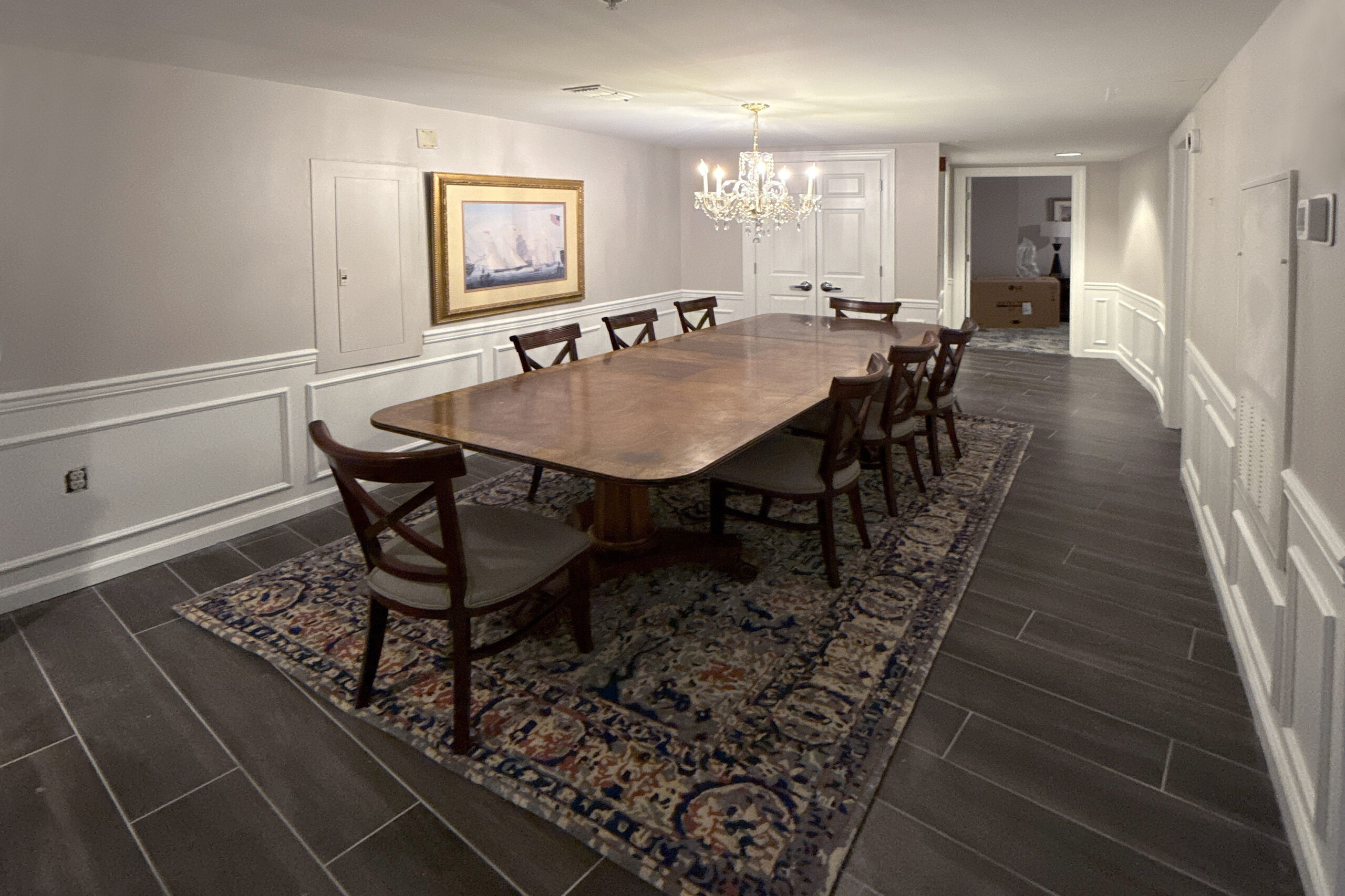 Suite dining room at Wyndham Old Town Alexandria with chandelier and wainscoted walls