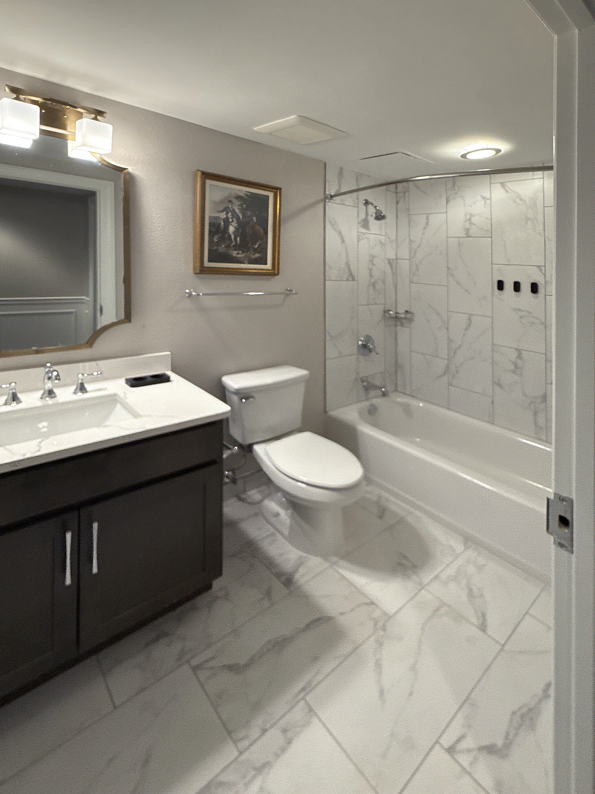 Renovated guest bathroom at Wyndham Old Town Alexandria with tub, shower and marble tiling