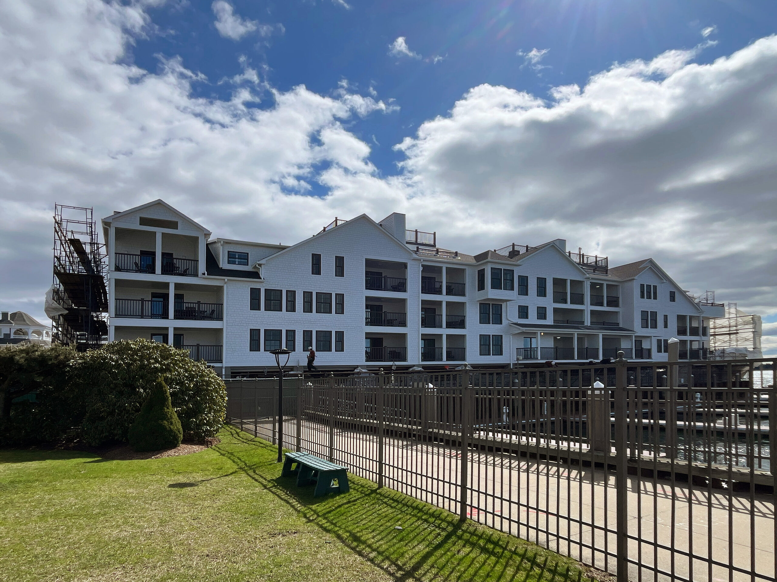 Wyndham Onshore Newport rear elevation with lawn, fencing and scaffolding during renovation