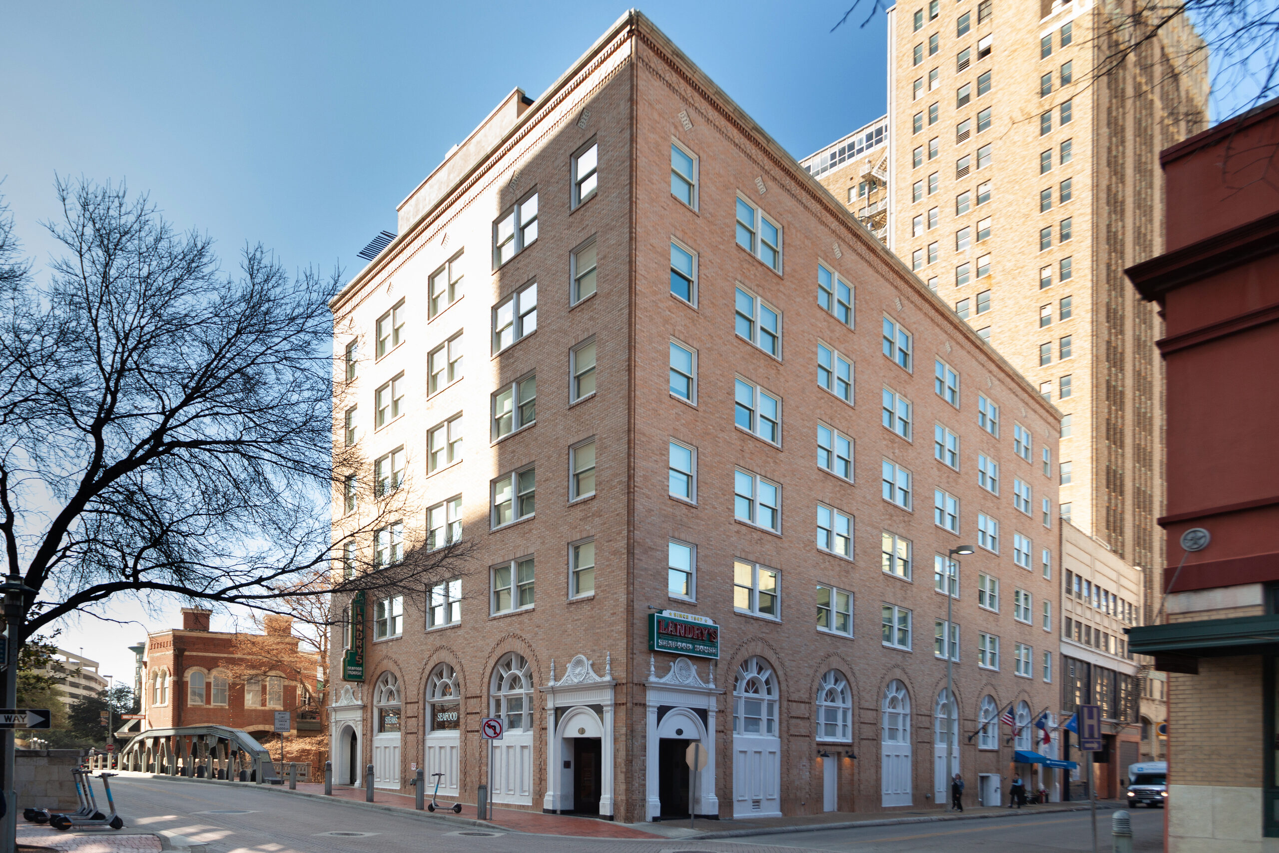 Wyndham Riverside Suites seen from the street corner on a clear winter day